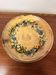Vintage round ceramic plate with floral decoration.
