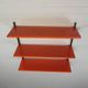 Tomado Holland - A. Dekker wall shelf, orange and black, 1970s
