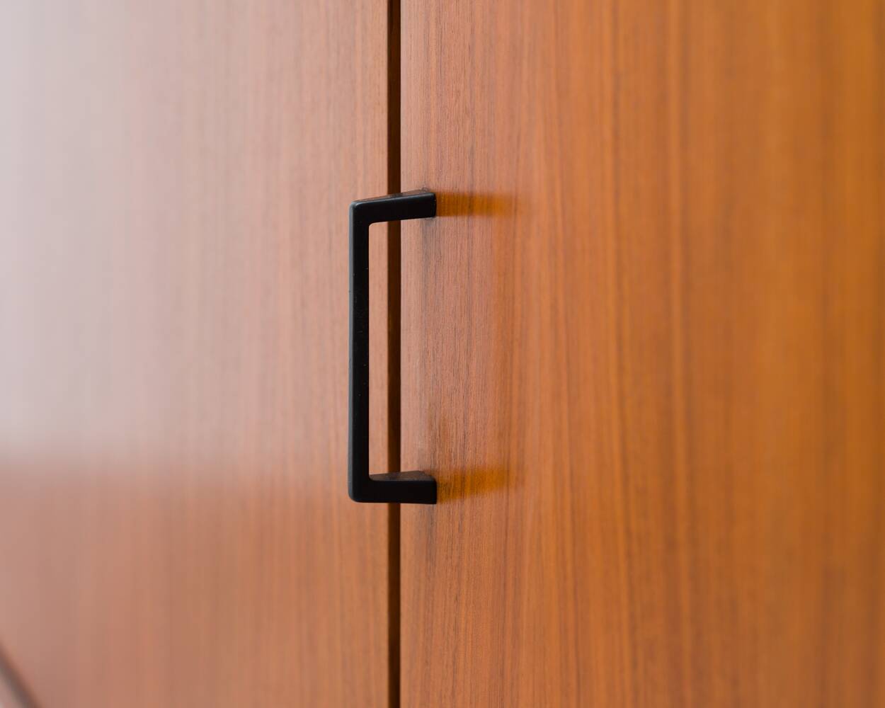 1960s walnut two-door cabinet.