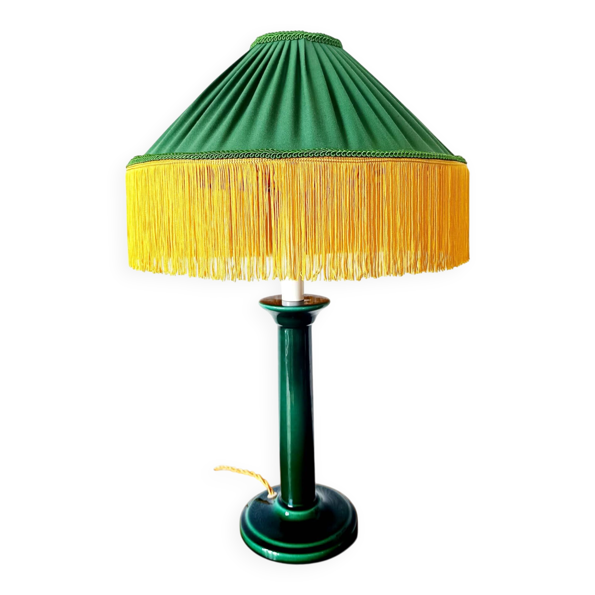 Green ceramic lamp with a vintage pleated fringe shade.