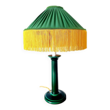 Green ceramic lamp with a vintage pleated fringe shade.