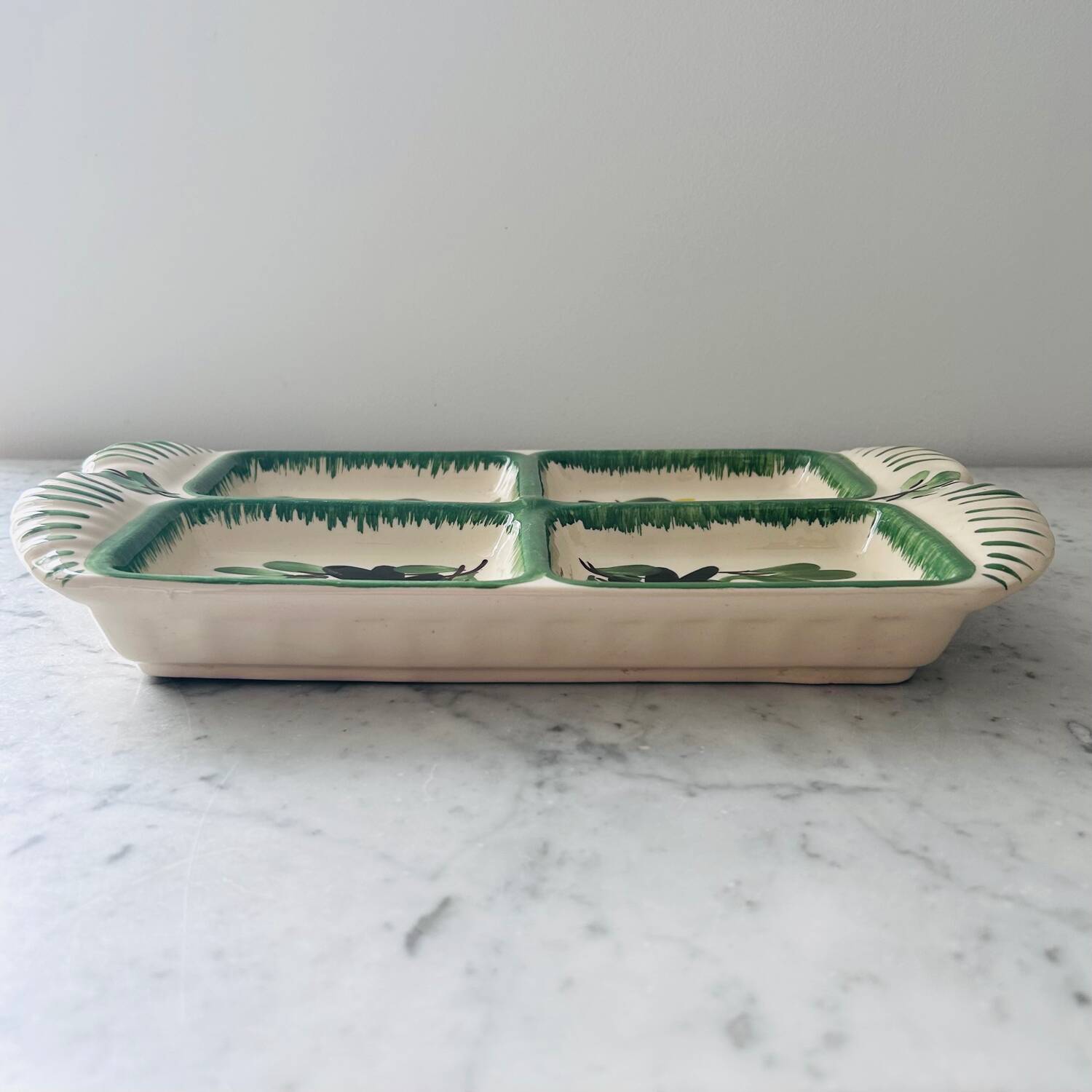 Serving dish with floral decoration signed