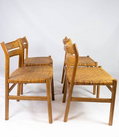 A set of four dining room chairs in oak and seat in papercord, designed by Børge Mogensen