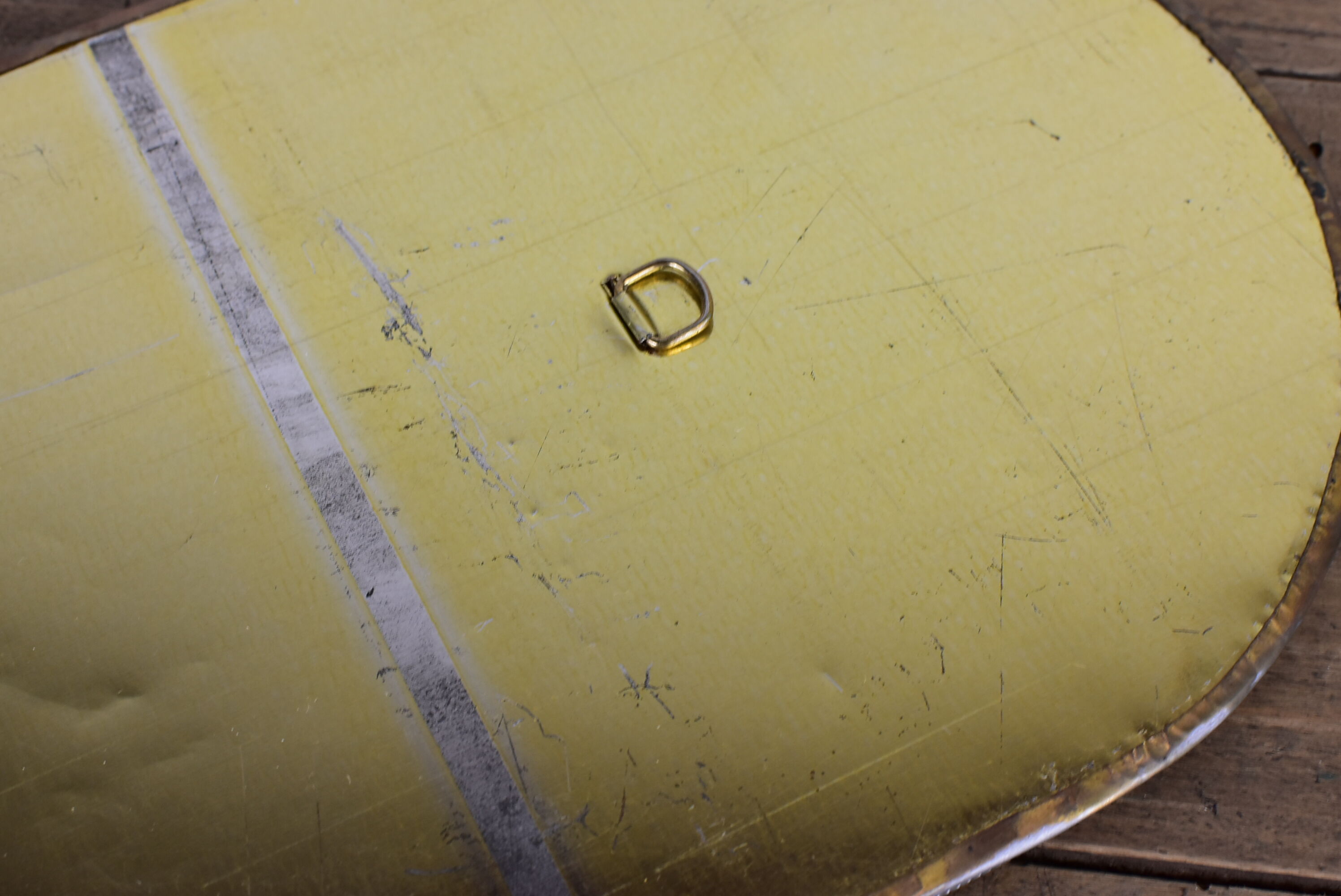 Decorated brass mirror.