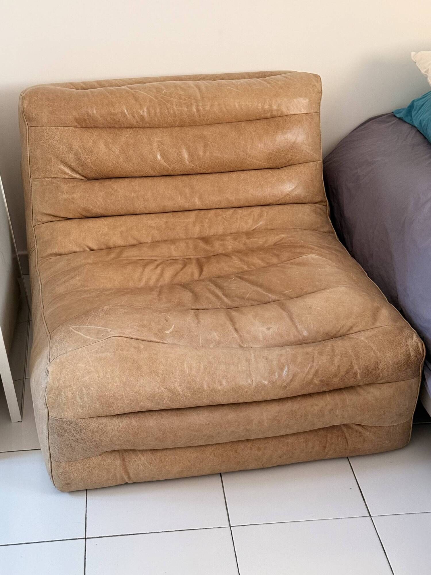 Vintage camel leather lounge chair, patinated, 1970s, Togo spirit.