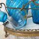 Antique Legras liquor cabinet, decanters and glasses, lion's paw stand