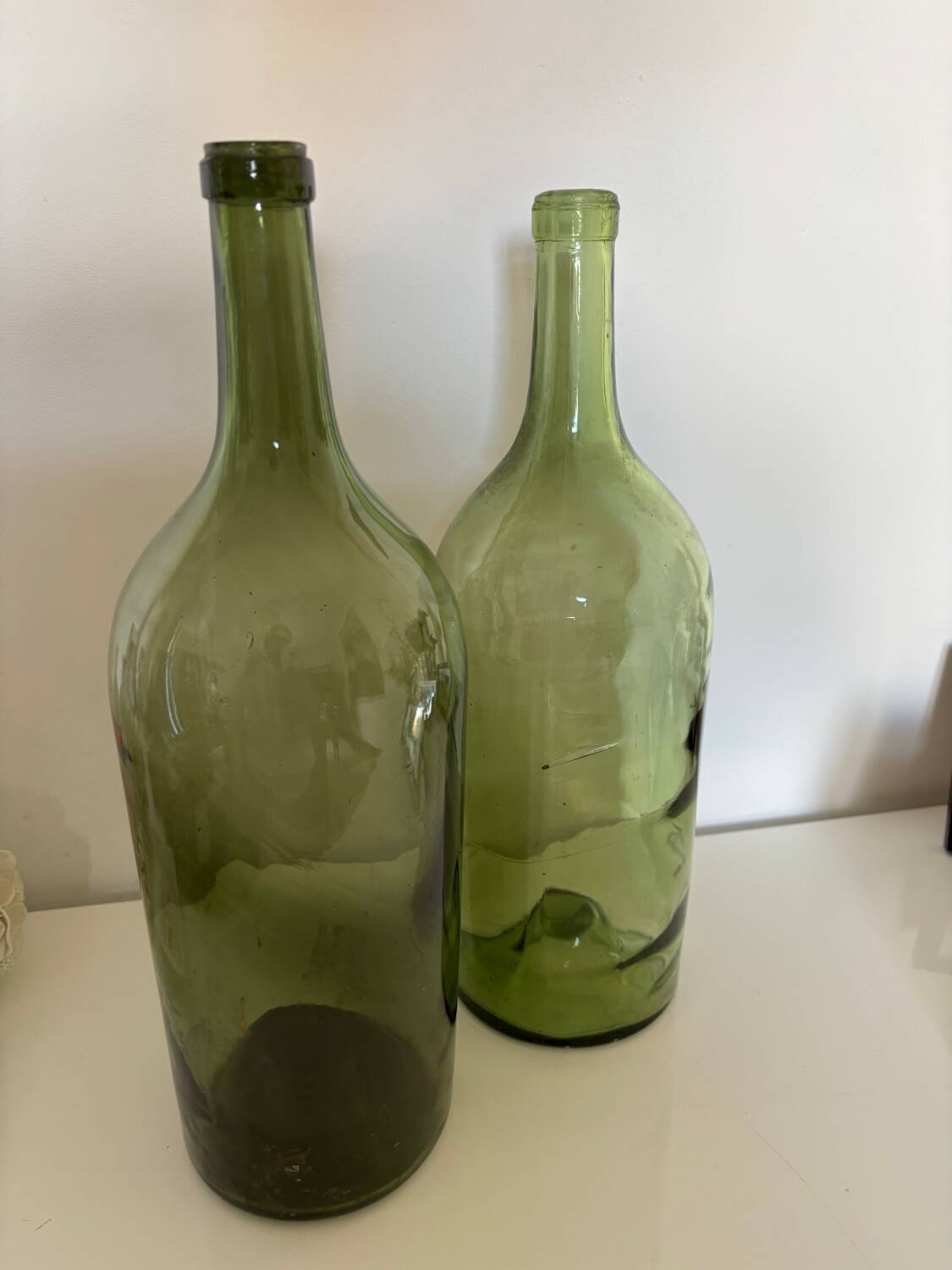 Pair of large antique blown glass bottles