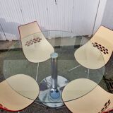 Guzzini dining set, round glass table and 4 shell chairs.
