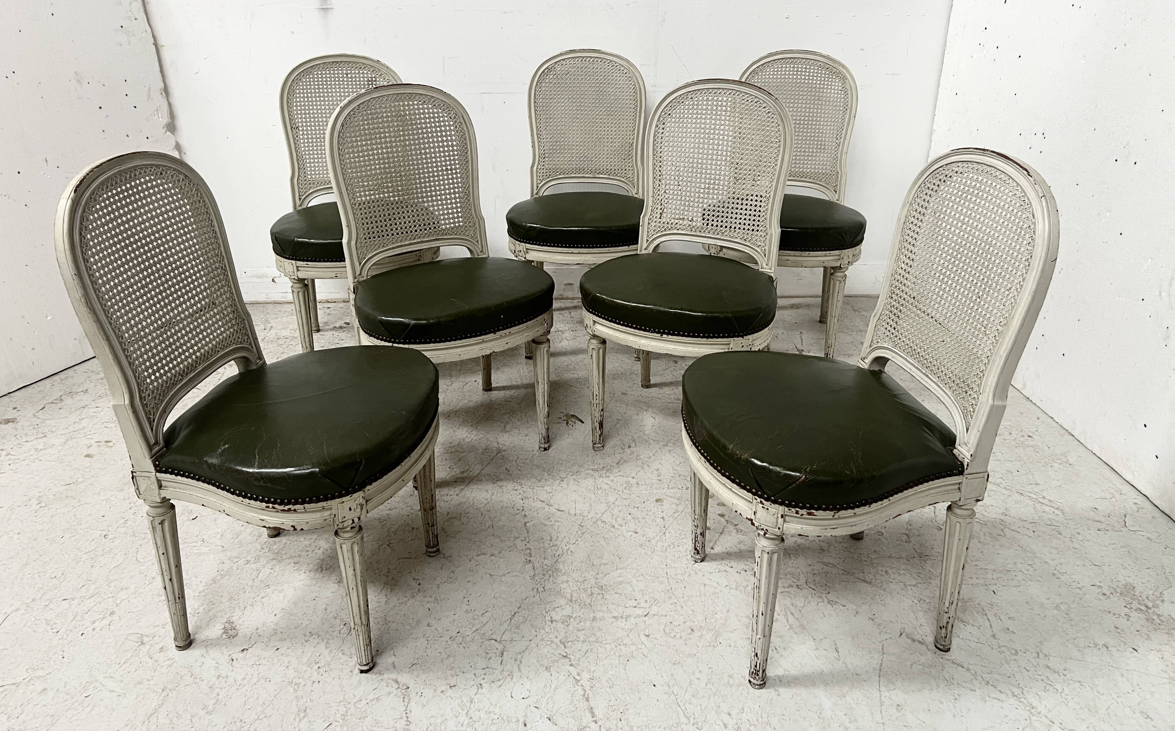 Set of seven Louis XVI style chairs in patinated beech, 20th century.