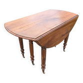 Large six-foot table with XIX century folding leaves in solid walnut Ø120 extendable to 330.