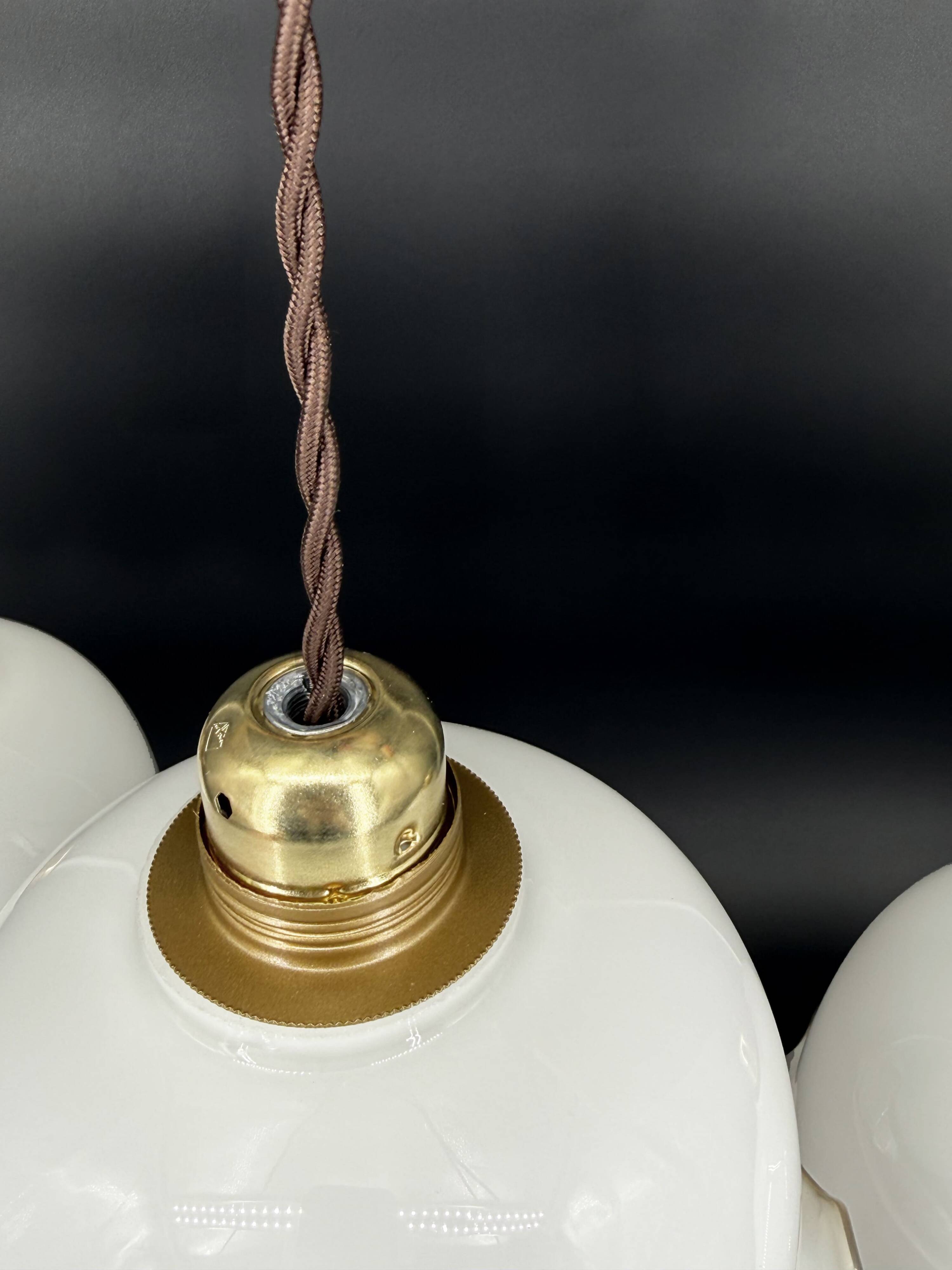 Set of 3 vintage bell-shaped pendants in white opaline with brown trim.