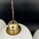 Set of 3 vintage bell-shaped pendants in white opaline with brown trim.
