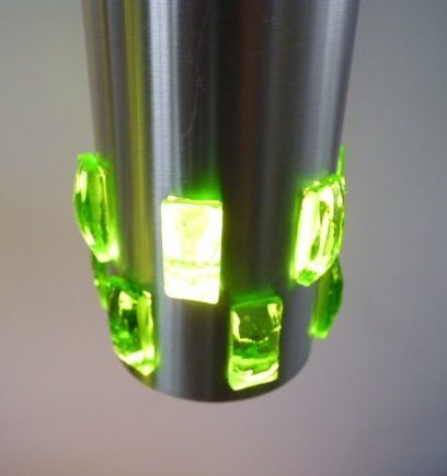 Suspension cascade of aluminum tubes with green glass