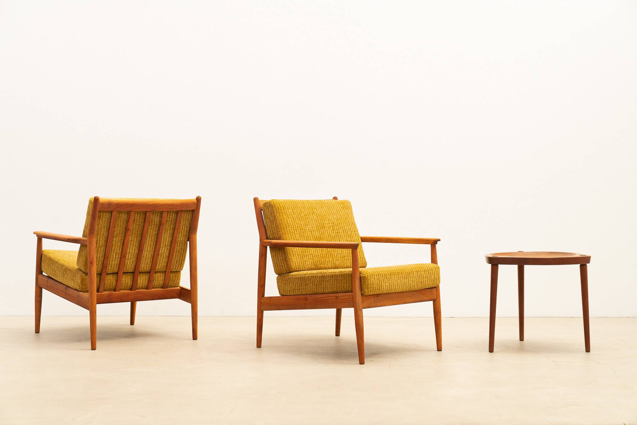 Pair of teak armchairs