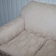 Victorian suite in damask, walnut frame, legs carved in lion's paw.