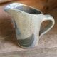 Pitcher in stoneware signed Jean Claude Monange, daisy motif yellow heart