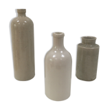Trio of old sandstone bottles and jars