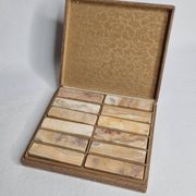 Set of 12 veined onyx knife rests, original box from the 1970s.