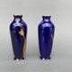 Pair of 1900 Limoges vases with blue background and gold highlights, R. Rosier decorations