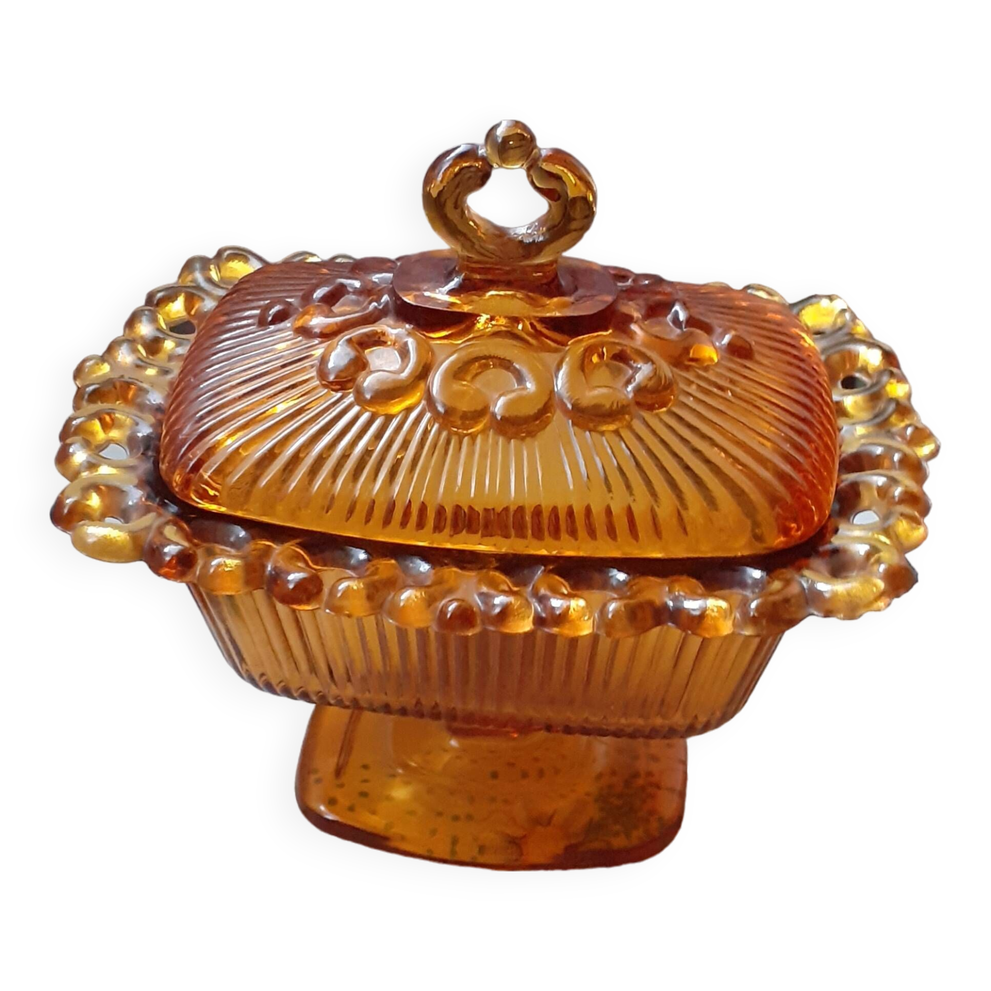 amber-colored pressed glass butter dish