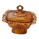 amber-colored pressed glass butter dish