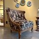 Armchair in a wooden confessional style with black and beige cotton.