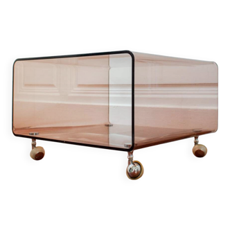 Smoked plexiglass side table on wheels by Michel Dumas