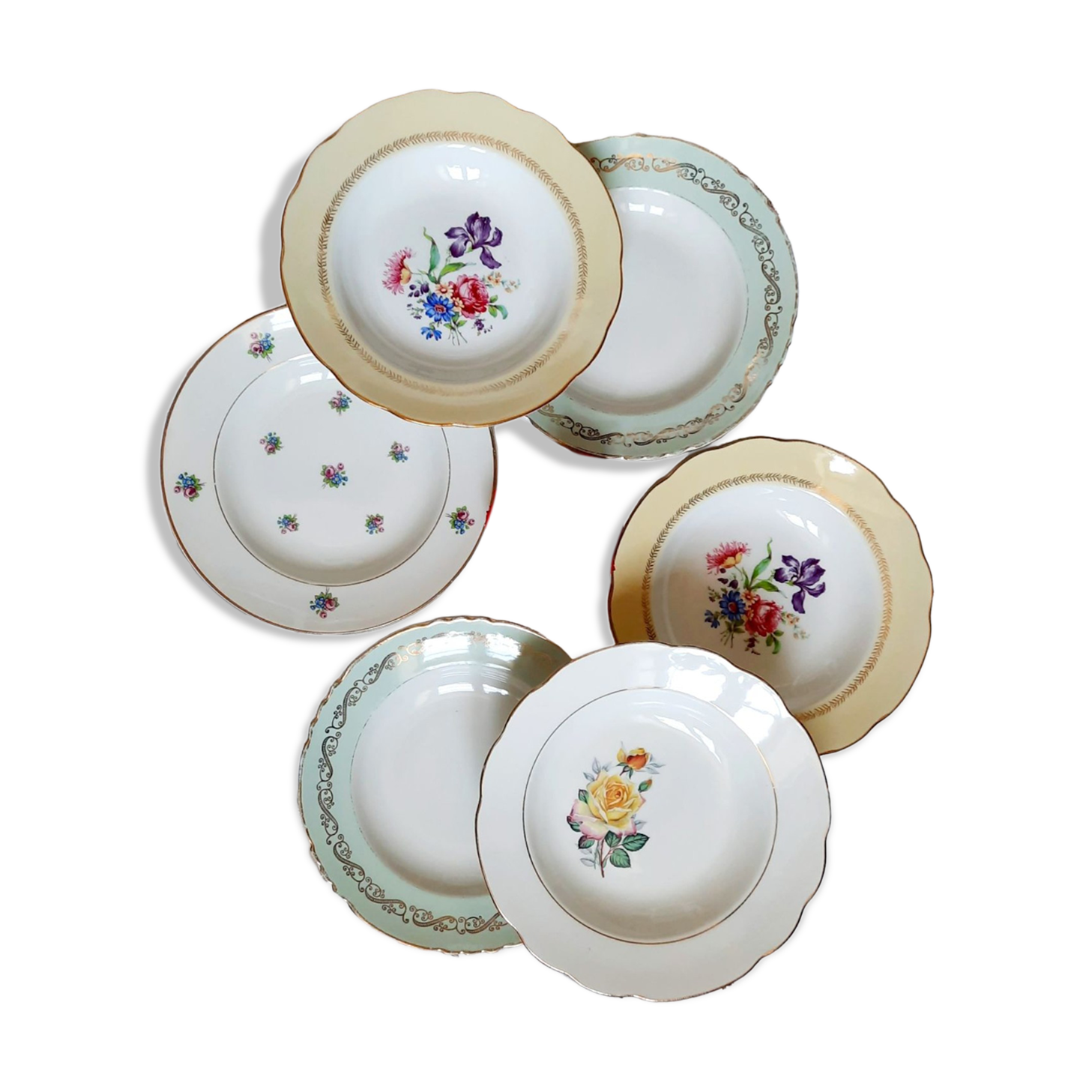 Old hollow plates mismatched in earthenware with gilded edges