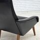 1970s, Danish armchair, black artificial leather, teak wood legs.