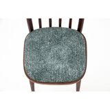 Ensemble de quatre chaises vertes vintage