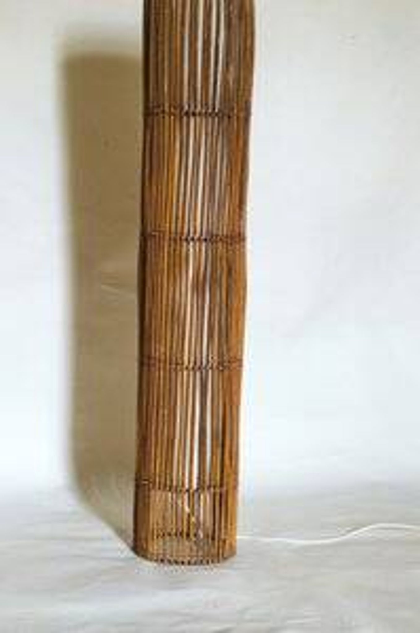 Mid-century rattan floor lamp, in the style of Louis Sognot.
