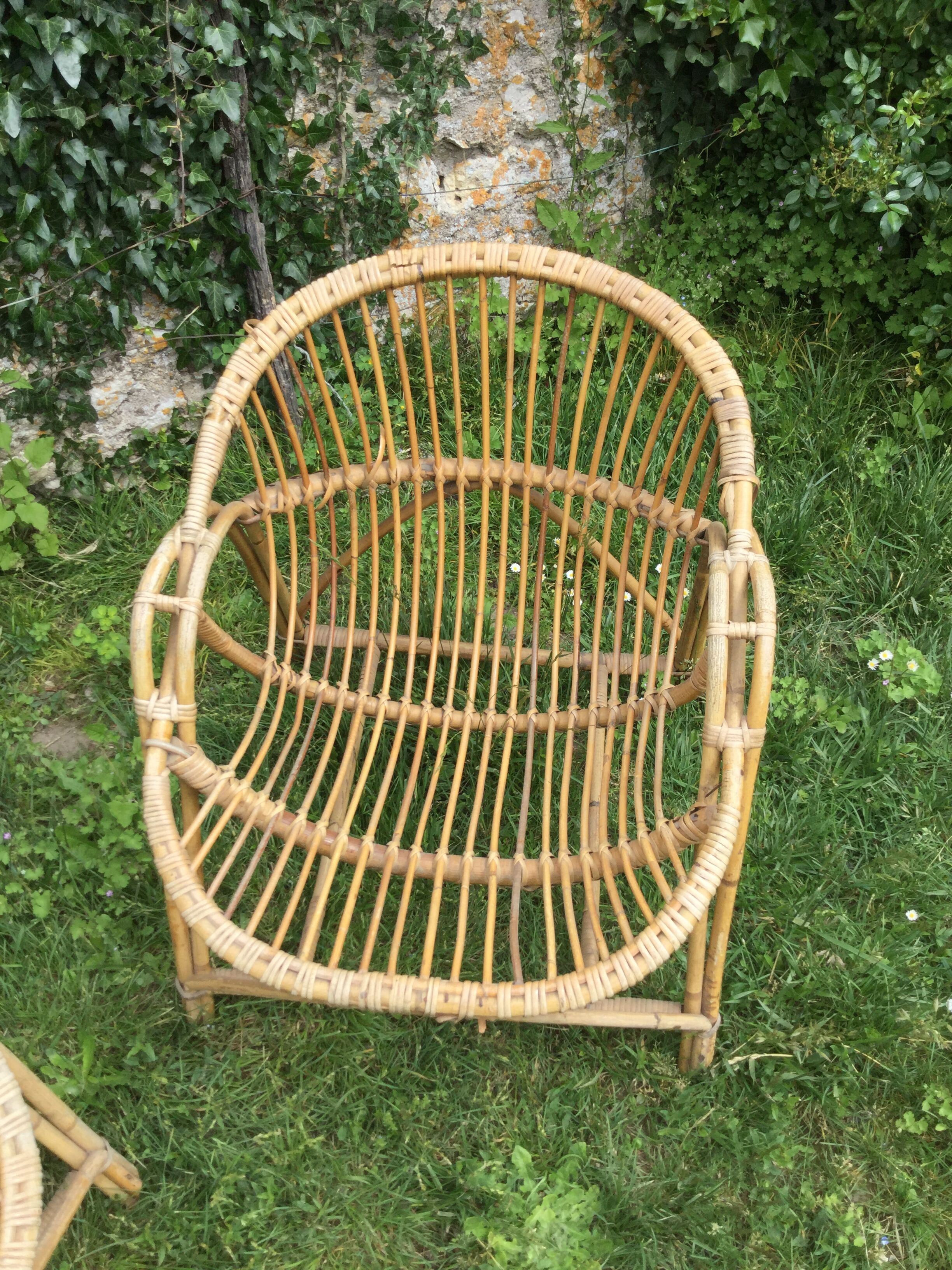 A pair of rattan armchairs