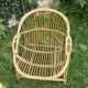 A pair of rattan armchairs