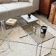 Set of 2 vintage nesting coffee tables in chrome metal and smoked glass.