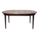 Extendable dining table in Rio rosewood.