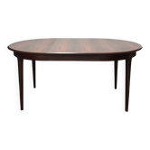 Extendable dining table in Rio rosewood.