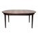 Extendable dining table in Rio rosewood.