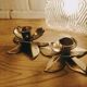 Duo of brass star candle holders