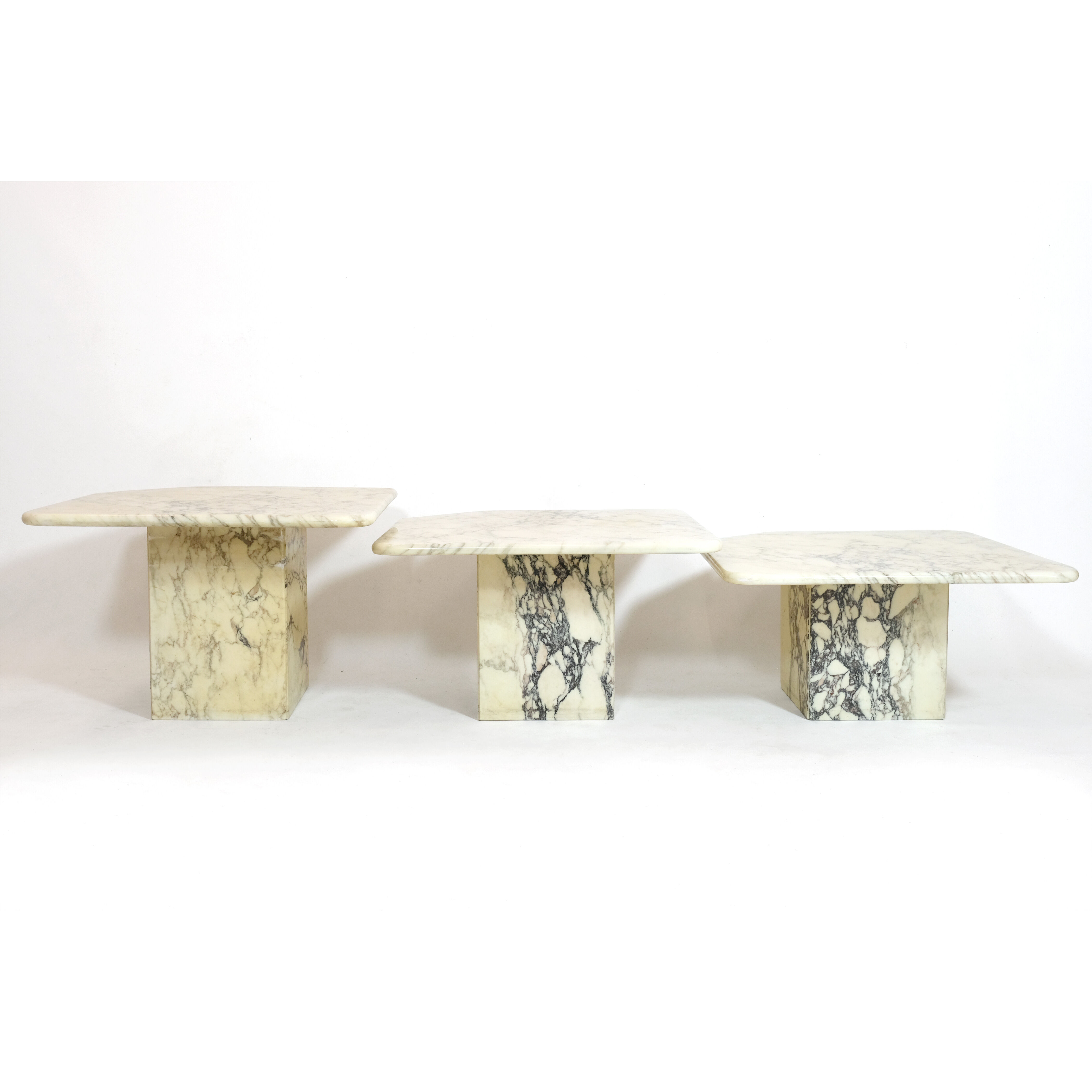 Suite of three marble trundle tables, 1970s