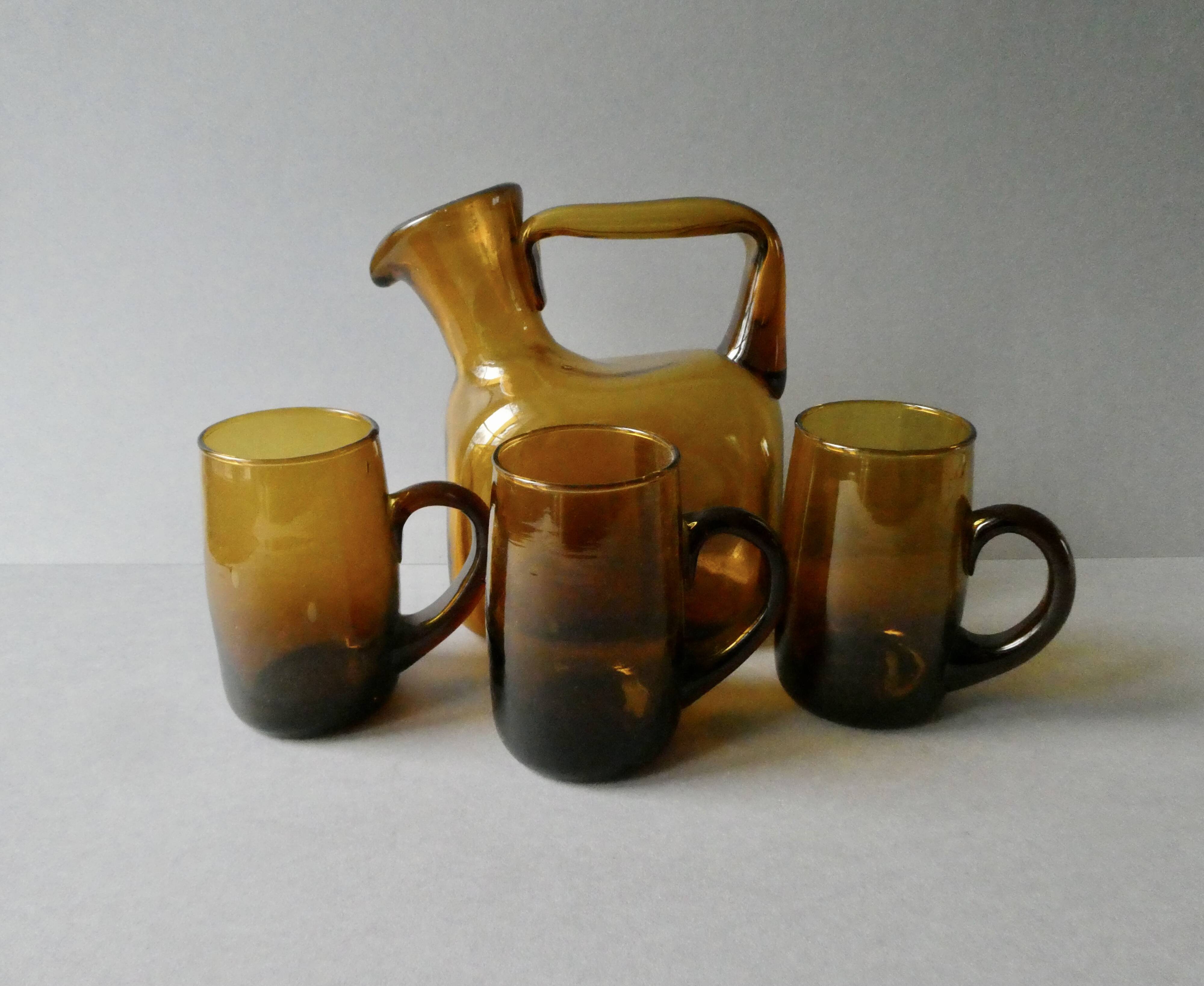 1 blown glass pitcher and its cups, 60s-70s