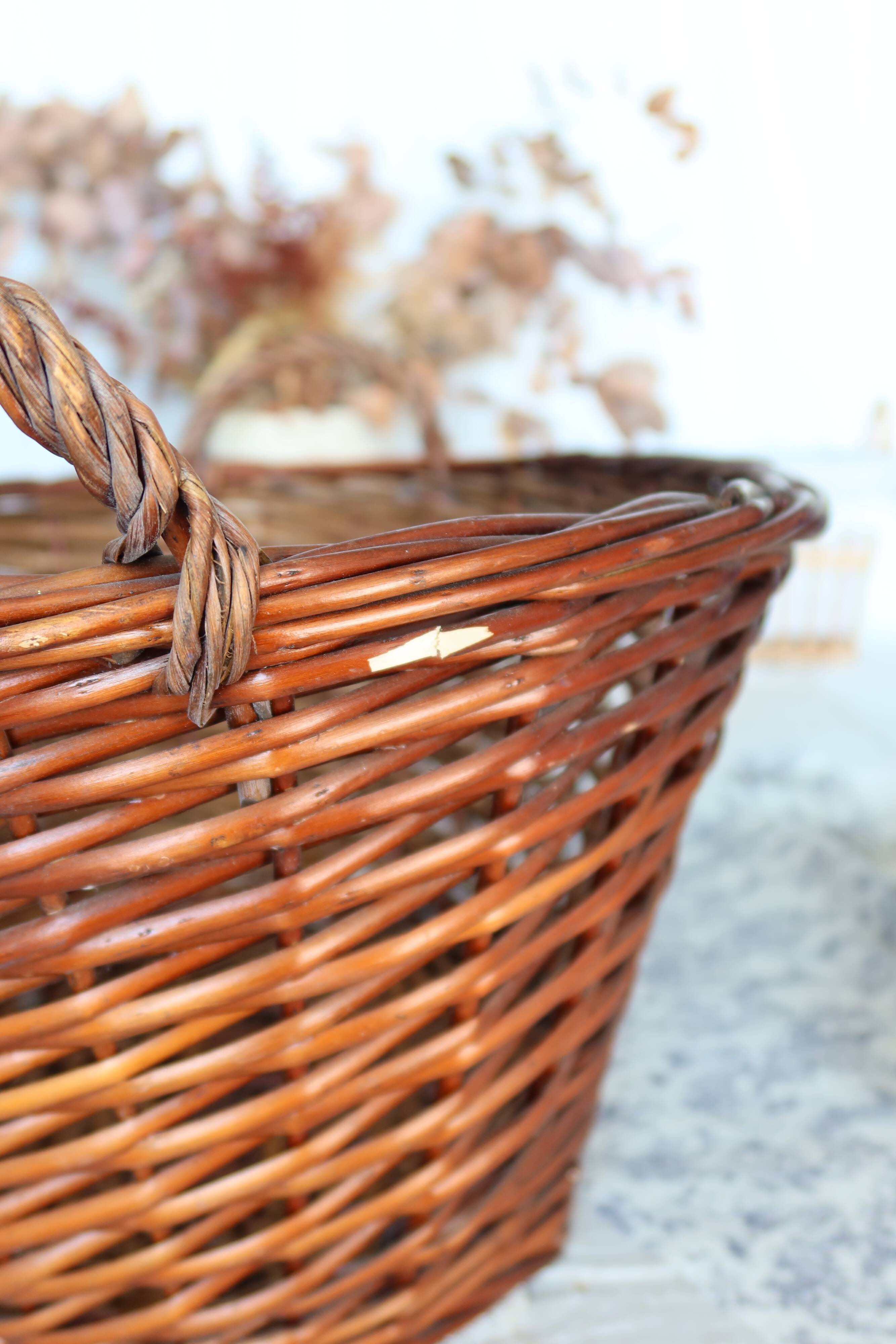 Large vintage dark wicker basket with handles