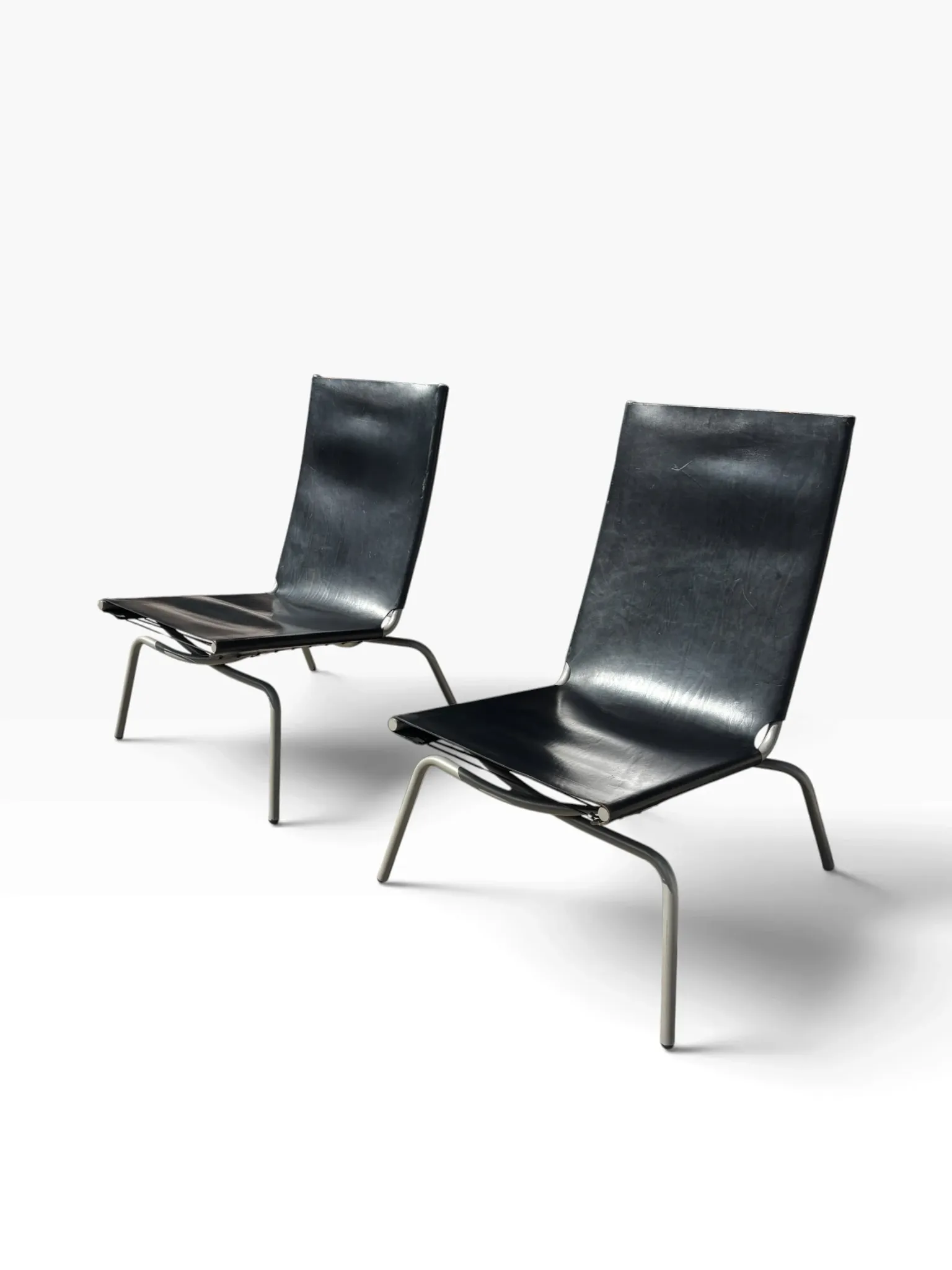 Set of 2 Crossed Legged lounge chairs by Fabiaan van Severen.