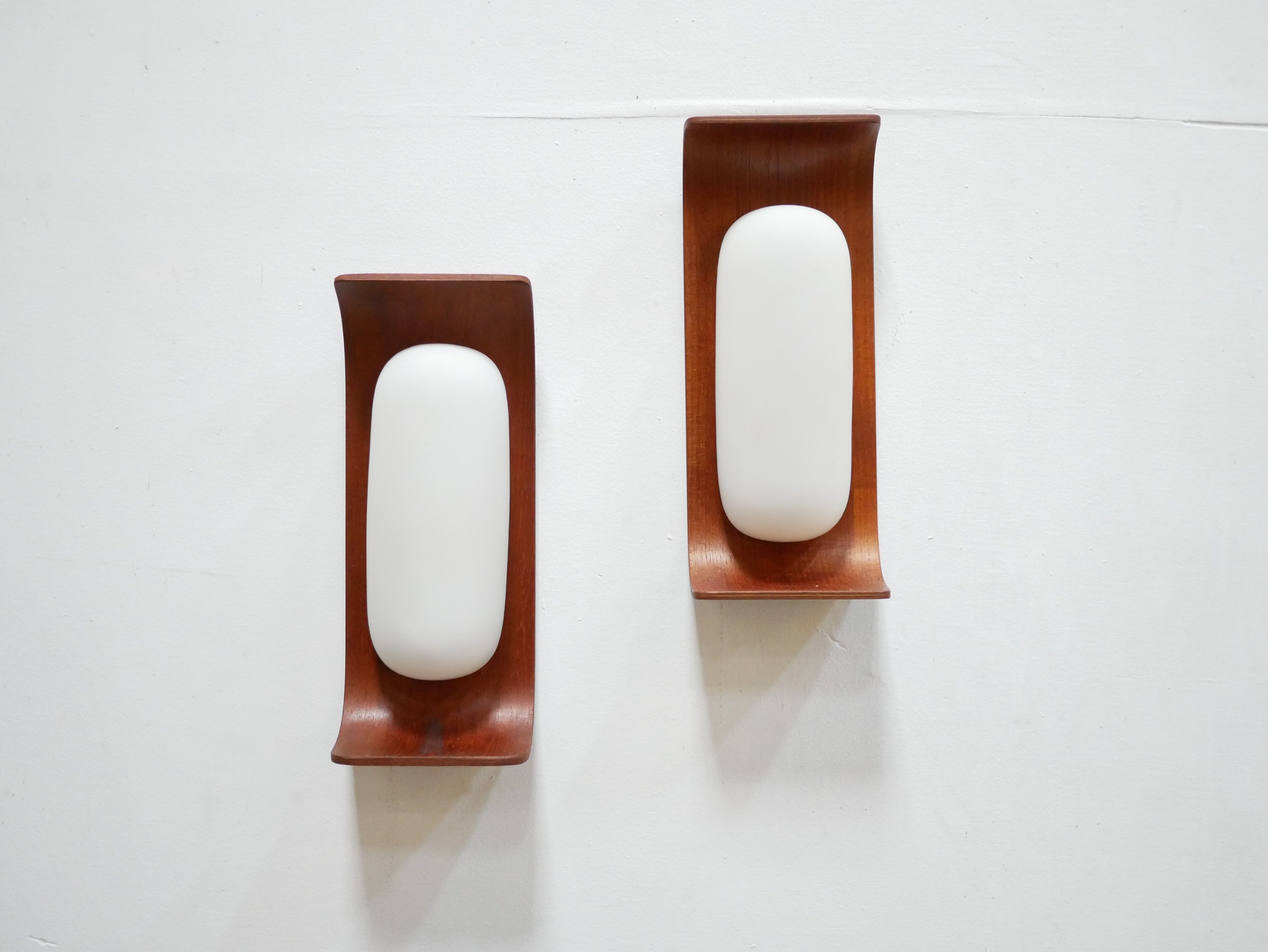 Pair of teak and opaline wall lamps by Goffredo Reggiani