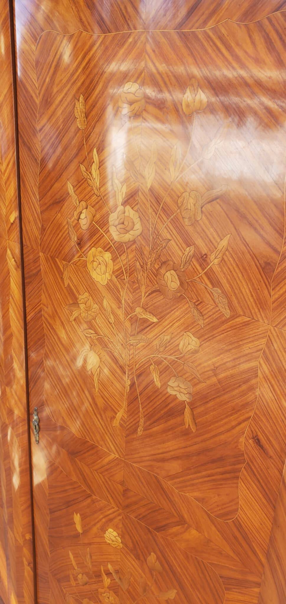Two-door cabinet with marquetry floral design from the early 20th century.
