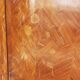 Two-door cabinet with marquetry floral design from the early 20th century.