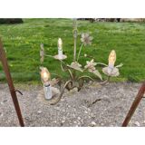 Vintage gold metal chandelier with floral decoration.