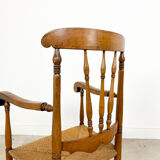 Antique oak and elm wooden armchair with cane seat