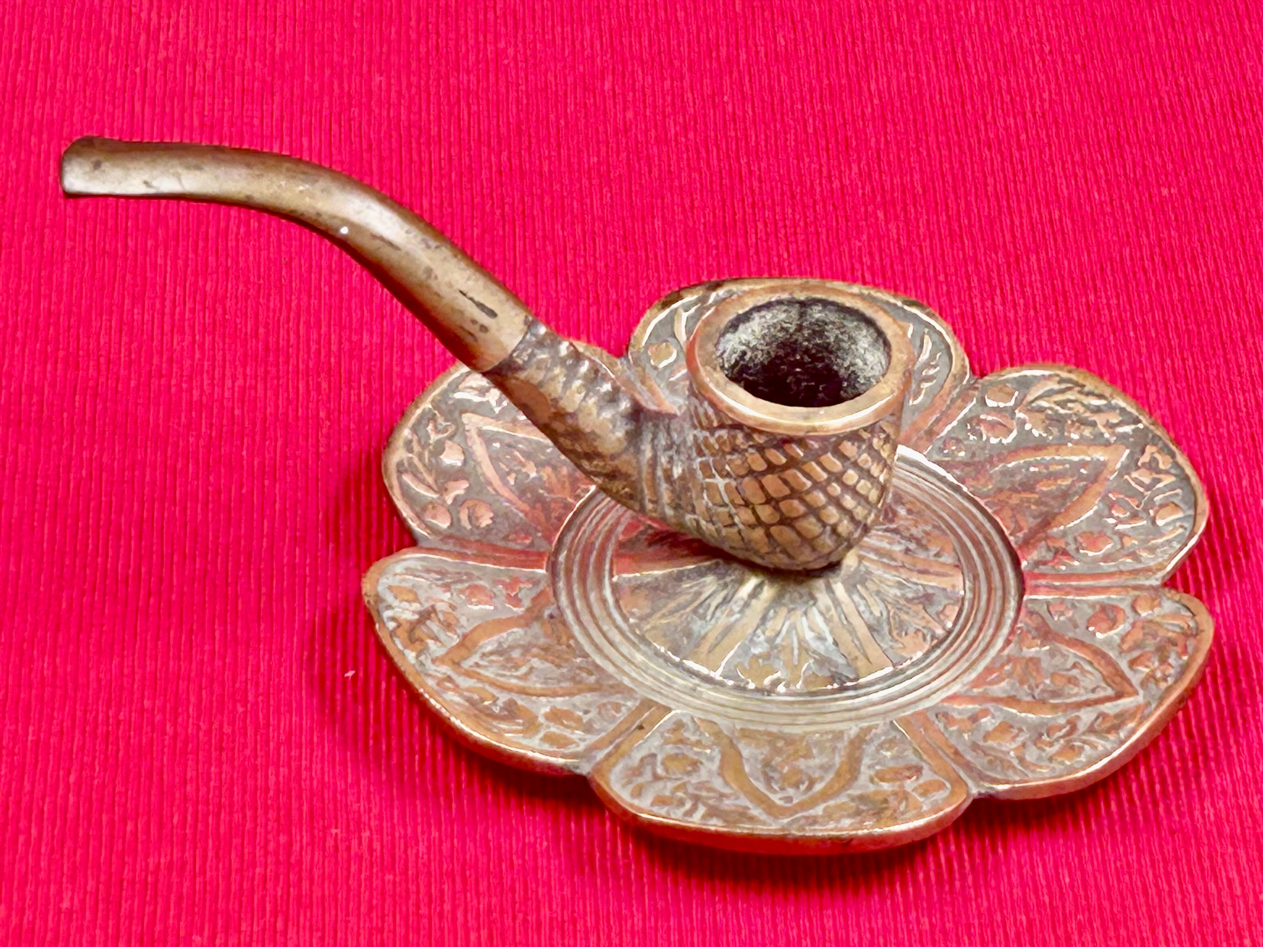 antique hand candlestick known as a rat of the cellar in bronze art Pipe