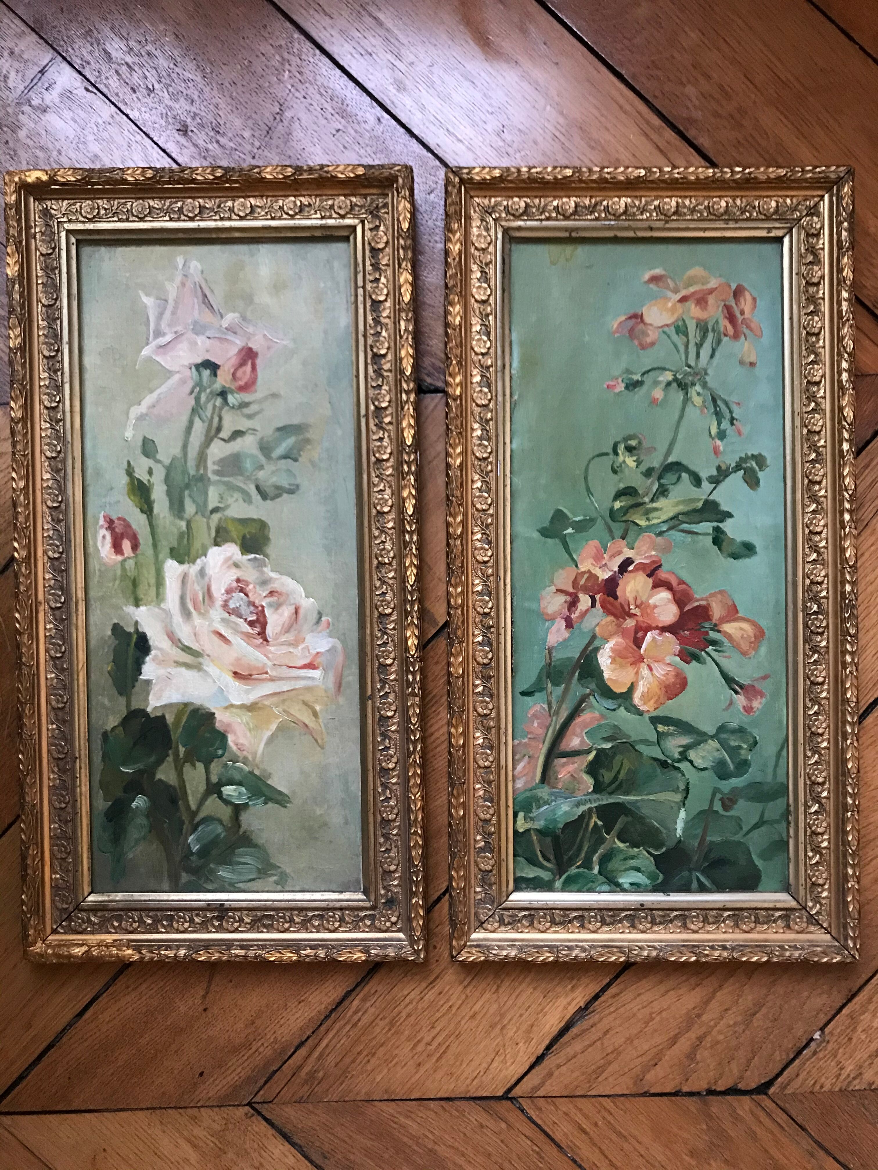 Two old paintings of flowers and gilded frames
