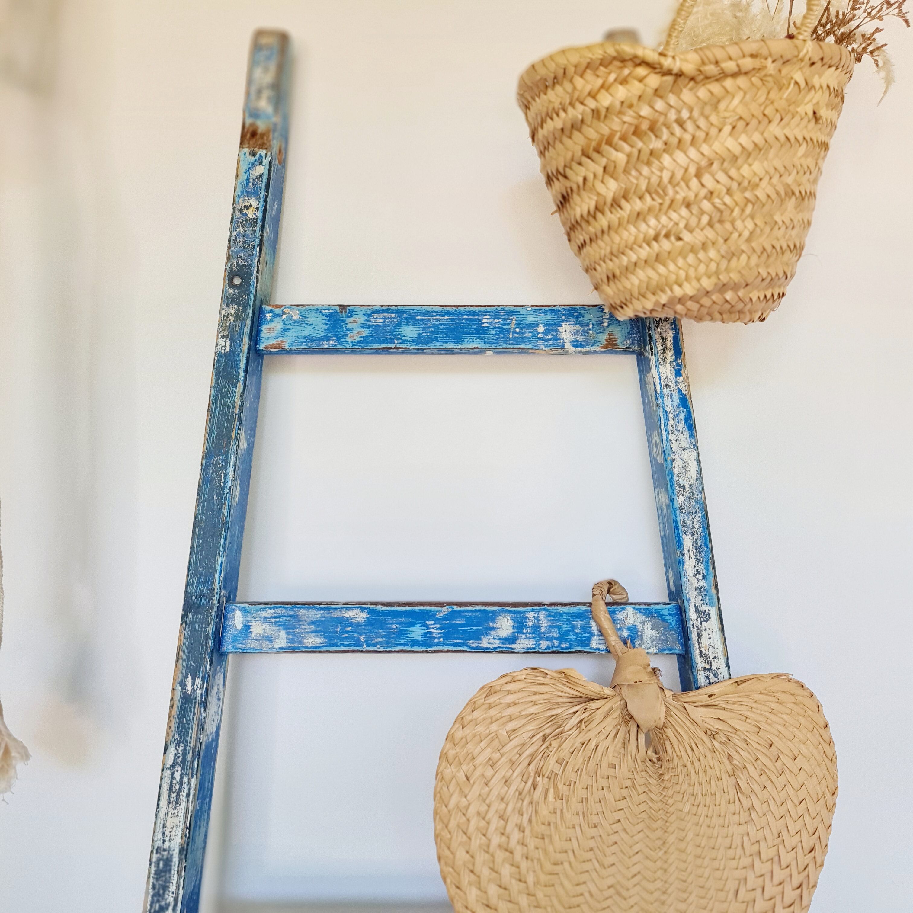 Old ladder in blue wood